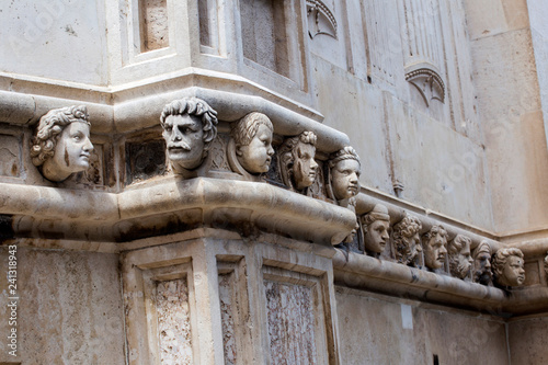 Sibenik Cathedral, Croatia.Human heads on the side portal of The Cathedral of St. James, Sibenik,Croatia.The Cathedral is the UNESCO World Heritage Site - Image