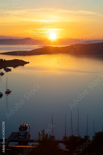 romantic sunrise over the small holiday marina, Zut island, Croatia photo