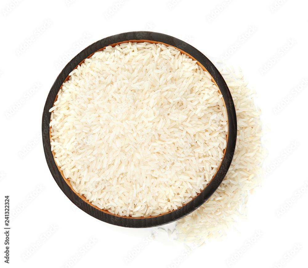 Plate with uncooked rice on white background, top view Plate with uncooked rice on white background, top view
