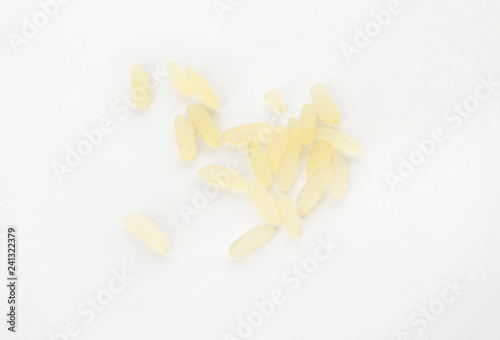 Uncooked rice on white background, top view