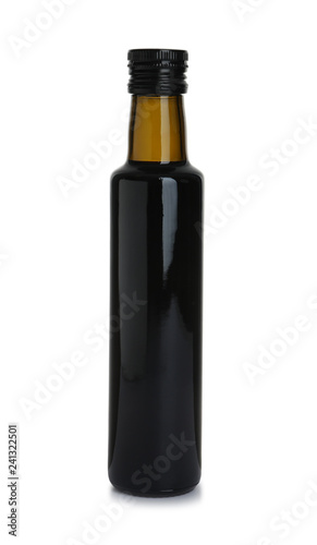 Bottle with balsamic vinegar on white background