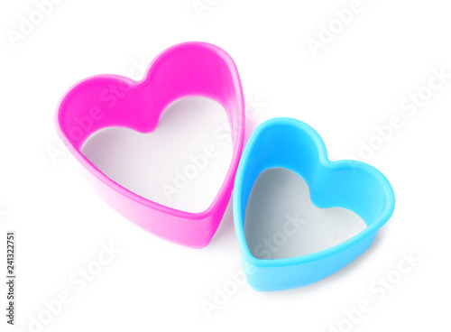 Heart shaped cookie cutters on white background