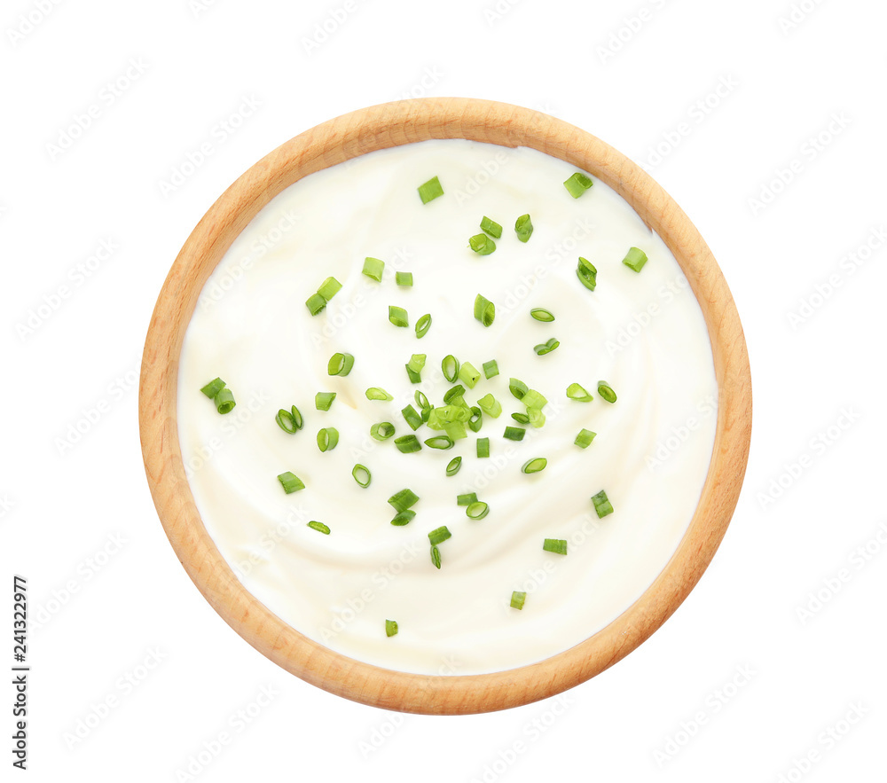 Bowl with sour cream and herbs on white background, top view Bowl with sour cream and herbs on white background, top view