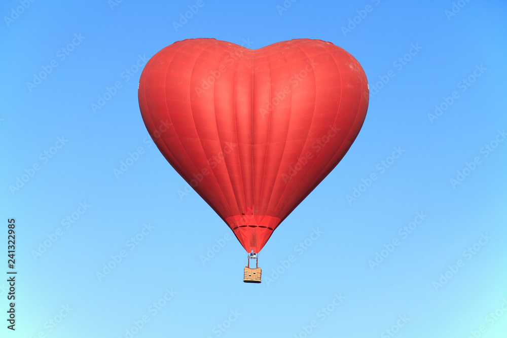 Naklejka St. Valentine's day. The flight on a hot air balloon in the shape of the heart