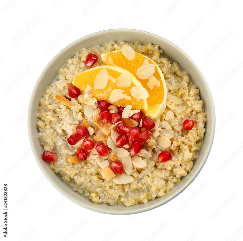 Bowl of quinoa porridge with nuts, orange and pomegranate seeds on white background, top view Bowl of quinoa porridge with nuts, orange and pomegranate seeds on white background, top view