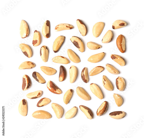 Composition with Brazil nuts on white background, top view