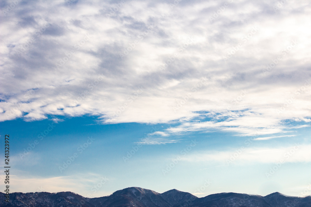 Cloudy sky and mountains.