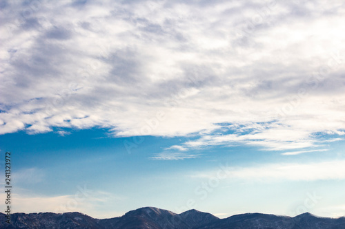 Cloudy sky and mountains.