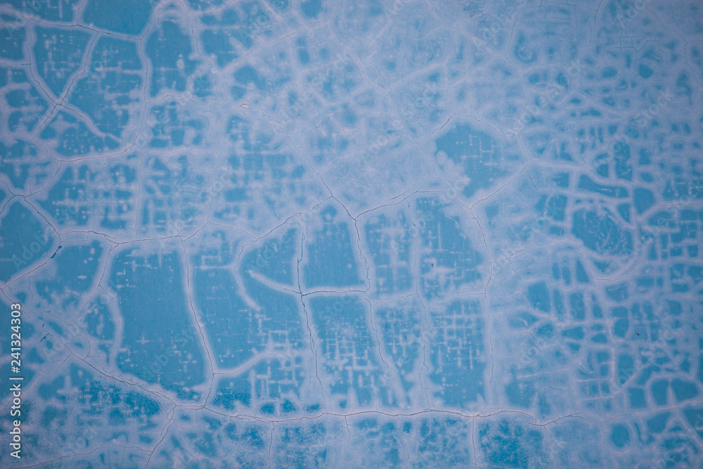 Fototapeta premium Cracked paint pattern on the blue wall