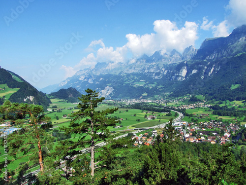 Panoramic view of the Berschis heritage in the river Seez valley or in the Seeztal and on Churfirsten peaks in mountain mass Toggenburg - Canton of St. Gallen, Switzerland photo