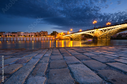 Seville, Spain, Night view of the fashionable and historic districts of Triana photo