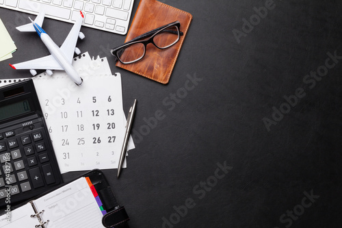 Business trip concept. Accessories on desk table
