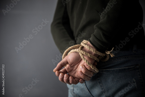 Hands tied up with rope © Daniel