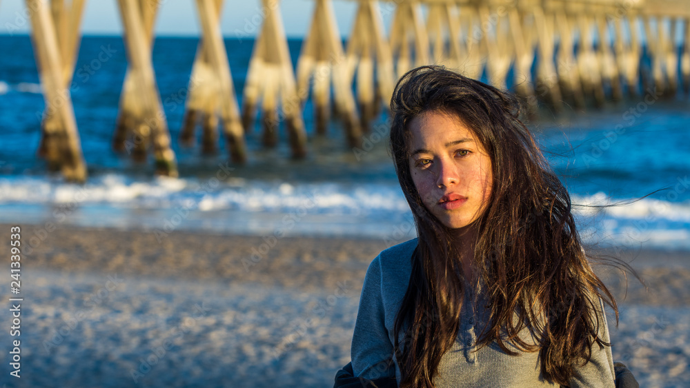 Young Asian-American at North Carolina Beach in winter Young Asian-American at North Carolina Beach in winter