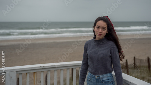 Young Asian-American at North Carolina Beach in winter