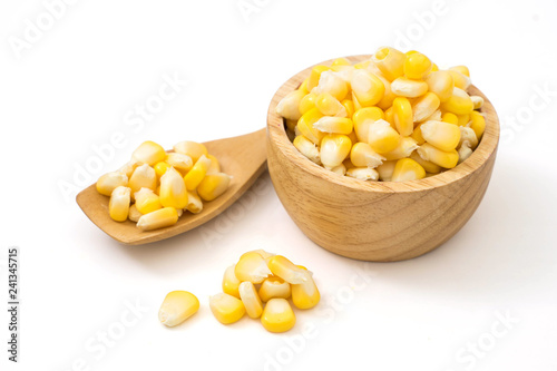 fresh sweet corn in wood bowl and spoon isolated