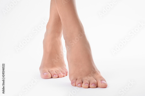 Woman with smooth feet on white background  closeup. Spa treatment
