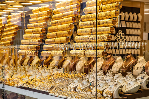 Istanbul, Turkiye -1 Ocak 2019 ; Golden accessories in the display window of a jewelery store. Turkish gold shop Istanbul. photo