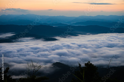  sunset overlooking mountains with Mist photo