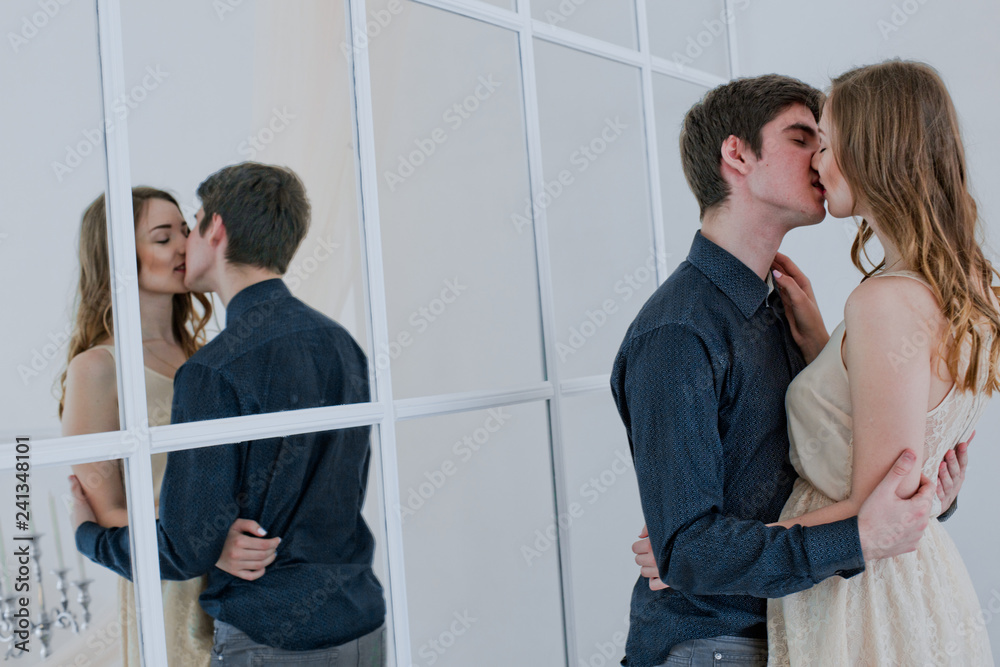 Gril Boy Sex - sex couple kisses. Lovers embrace. boy kisses girl on lips. Reflection of  lovers in mirror. Happy couple in love. Valentine's Day. Stock Photo |  Adobe Stock