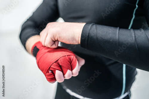 man with boxing hand wraps mma