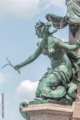 Beautiful mermaid at fountain named Mendebrunnen in Leipzig  downtown  Germany  summer