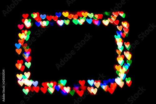 colorful hearts form a frame.bokeh hearts isolated on black background.frame hearts.