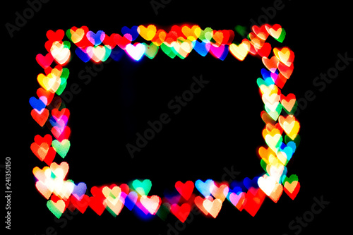 bokeh hearts isolated on a black background hearts of different colors form the frame.