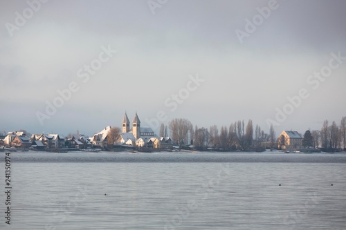 Winter atmosphere, view on Reichenau with church Peter and Paul with snow, island Reichenau, Baden-Wurttemberg, Germany, Europe photo