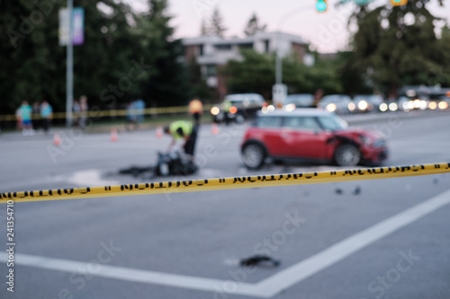 Wallpaper Mural Accident of motorcycle and car at crossroad, blurred. Caution yellow police line in foreground Torontodigital.ca