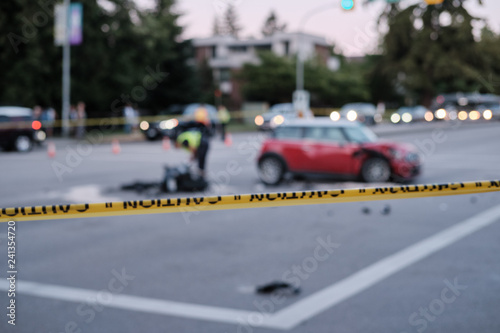 Wallpaper Mural Accident of motorcycle and car at crossroad, blurred. Caution yellow police line in foreground Torontodigital.ca