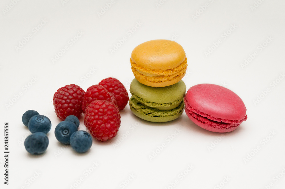 Colorful macaroon coolies with raspberry and blueberry berries Colorful macaroon coolies with raspberry and blueberry berries
