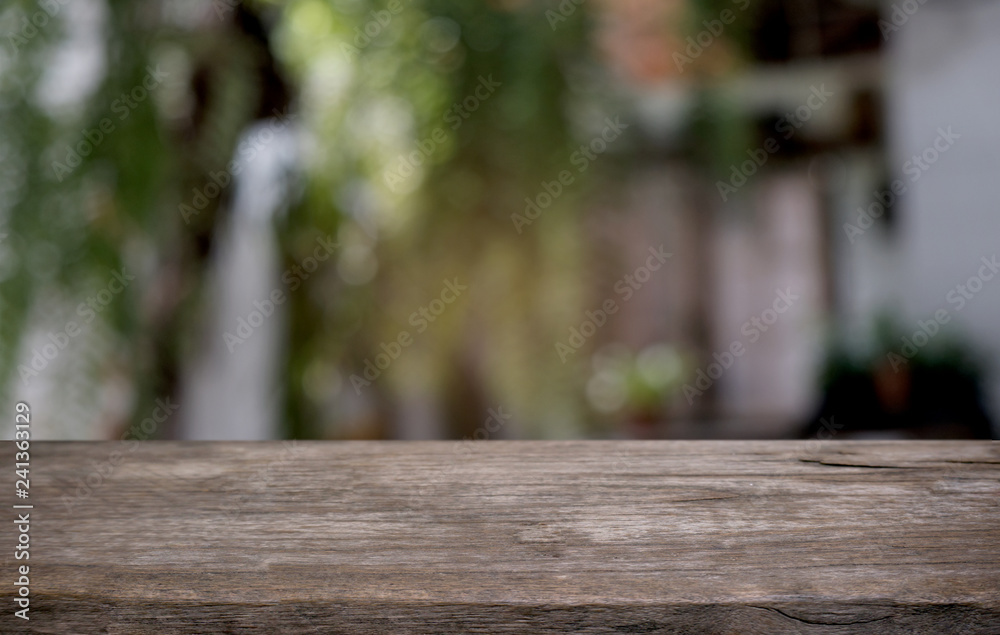 Empty dark wooden table in front of abstract blurred bokeh background of restaurant . can be used for display or montage your products.Mock up for space. Empty dark wooden table in front of abstract blurred bokeh background of restaurant . can be used for display or montage your products.Mock up for space.