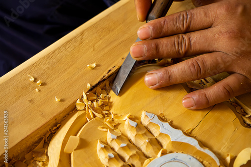 Wood carving in Thailand craftsman.