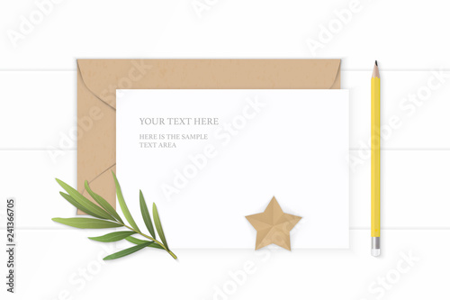 Flat lay top view elegant white composition letter paper kraft envelope star shape craft tarragon leaf and yellow pencil on wooden background