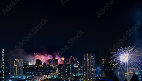 Celebration fireworks in the city at night time. landscape of Bangkok City. Thailand.