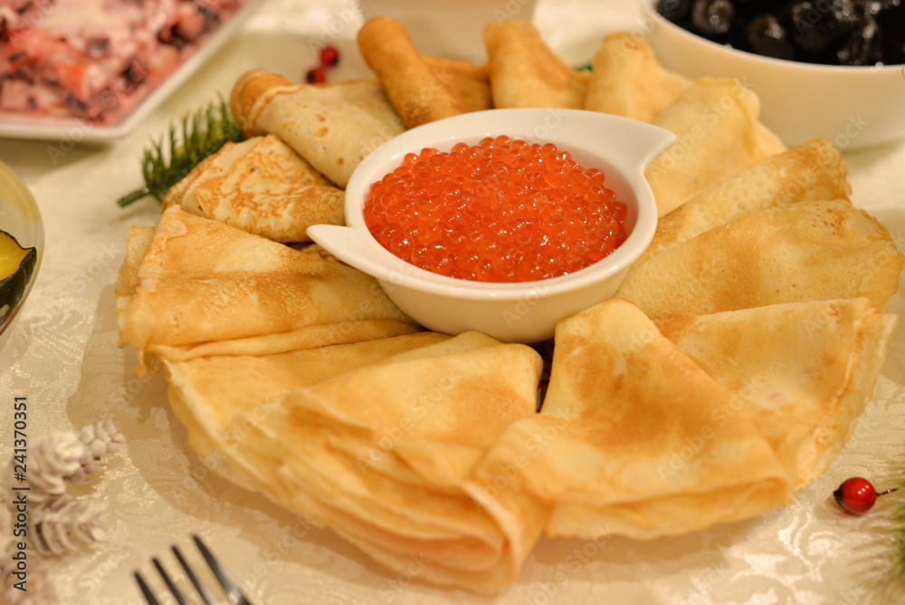 traditional thin Russian pancakes with red caviar traditional thin Russian pancakes with red caviar