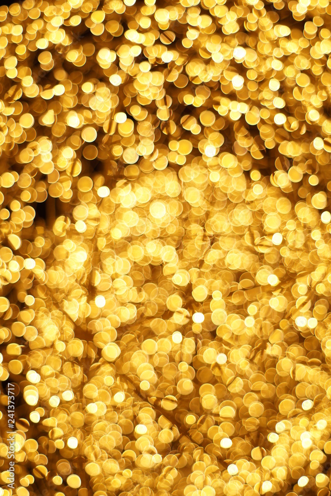 The golden bokeh blurred abstract pattern background The golden bokeh blurred abstract pattern background