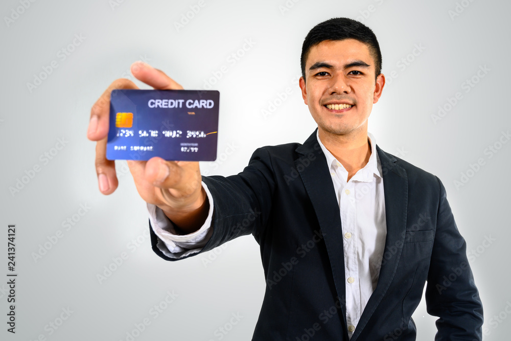 MEN BUSINESS WITH MOBILE PHONE OR CREDIT CARD IN WHITE BLACKGROUND MEN BUSINESS WITH MOBILE PHONE OR CREDIT CARD IN WHITE BLACKGROUND