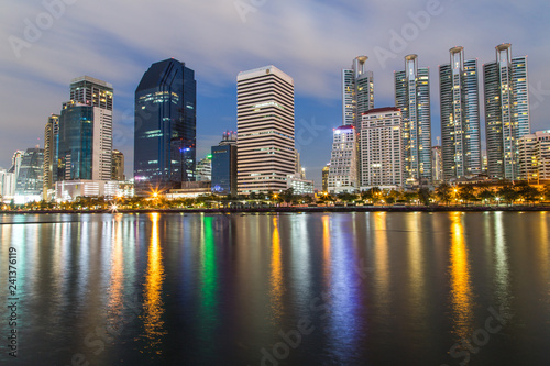 Bangkok twilight, Business building with light and reflection, view from Benjakitti park in Bangkok, Thailand © manusapon