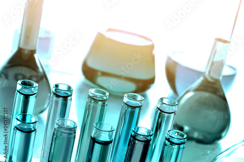 Laboratoy glassware with chemicals, chemistry science photo