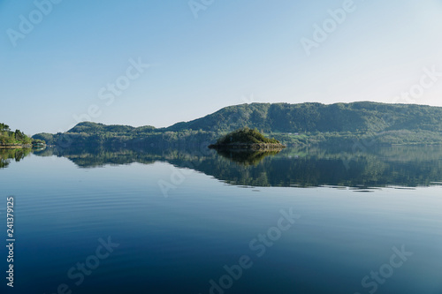 Fototapeta Naklejka Na Ścianę i Meble -  Norway beautiful spring landscape. Mountains reflection in calm water of fjord