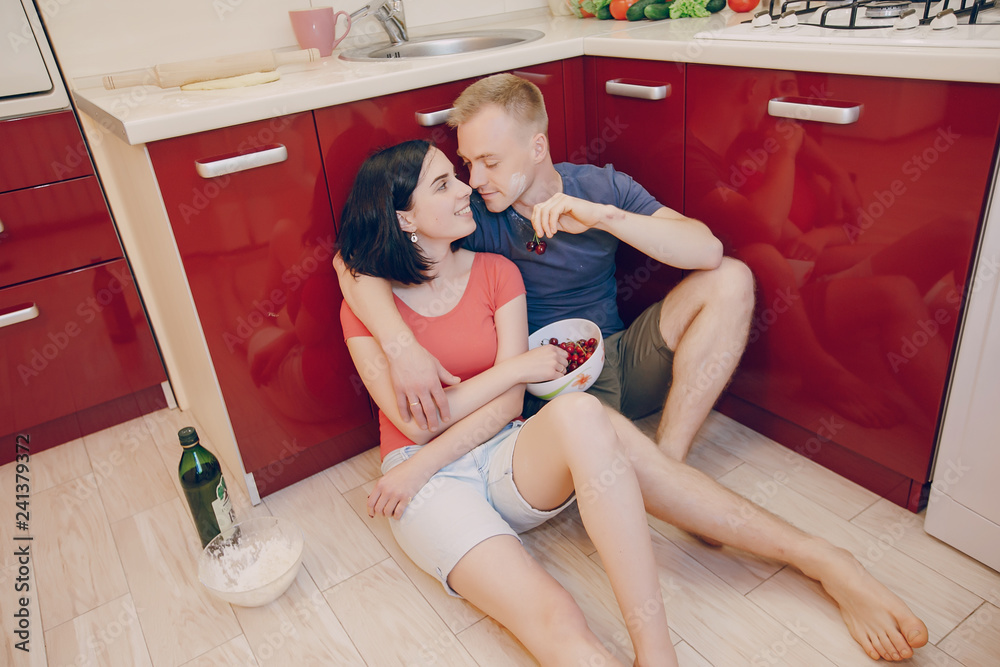 couple in a kitchen couple in a kitchen