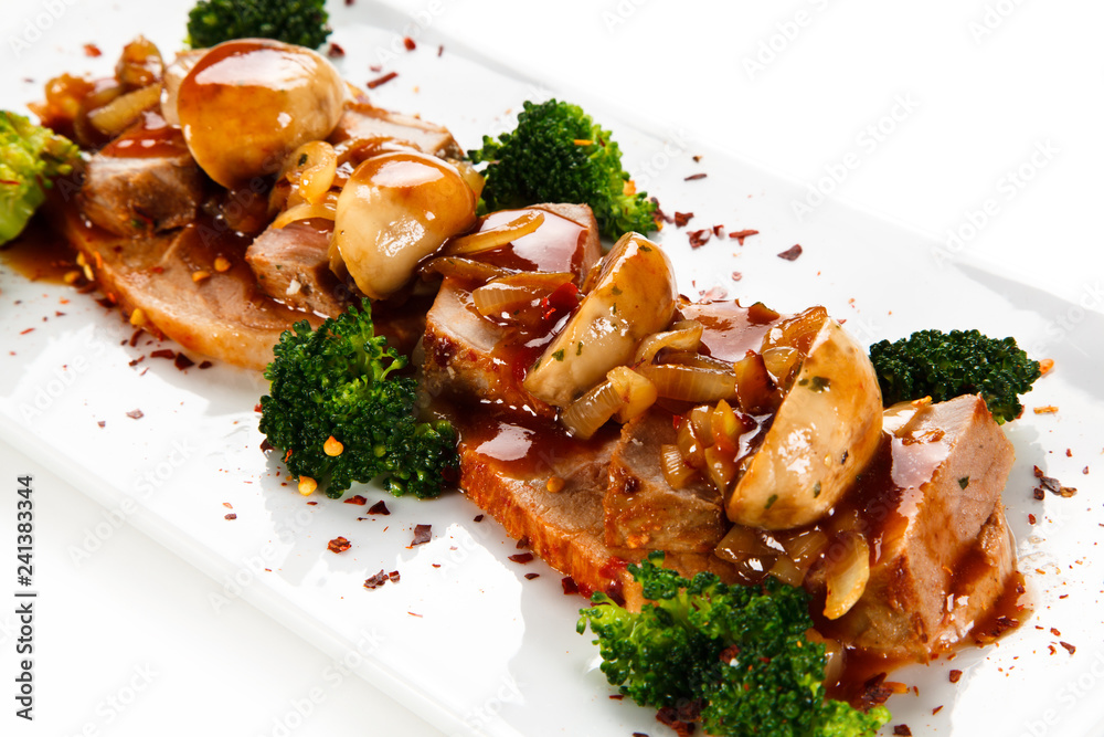 Fototapeta premium Grilled meat with broccoli and mushrooms on white background