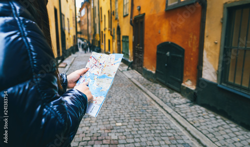Travel Lifestyle Woman traveler map hand street Stockholm