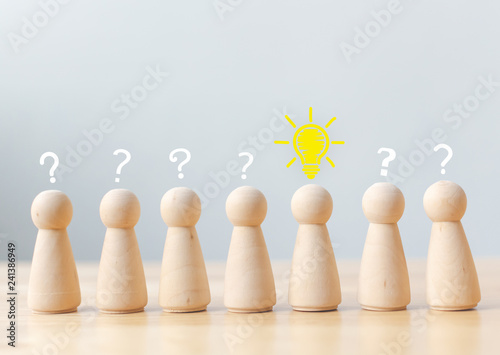 Creative thinking different new idea concept. Human wood with light bulb, question mark icon. Copy space for your text