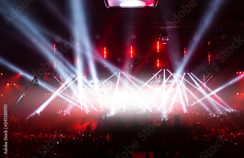 Stage illuminated by beautiful rays of lighting equipment.