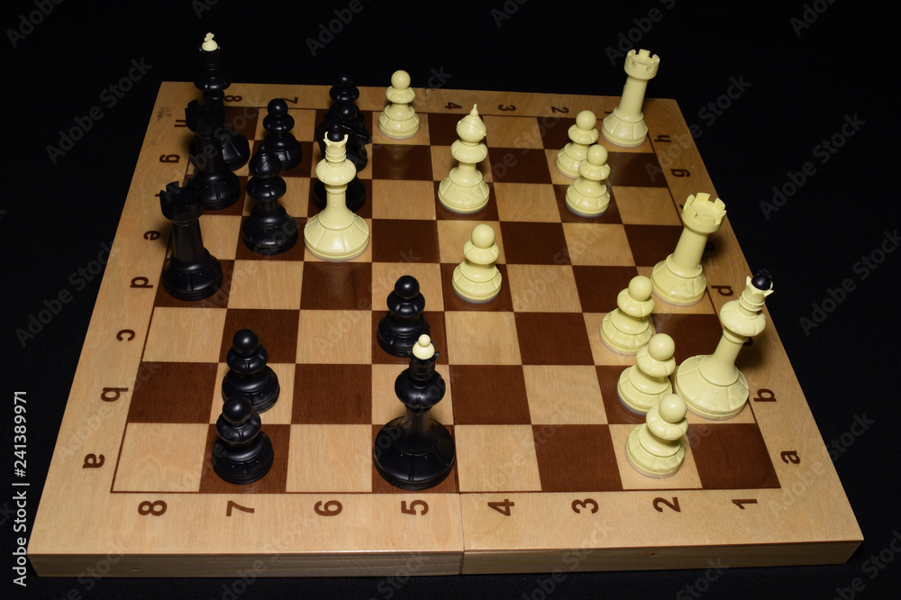 Chess board under white chessmen for strategy concept