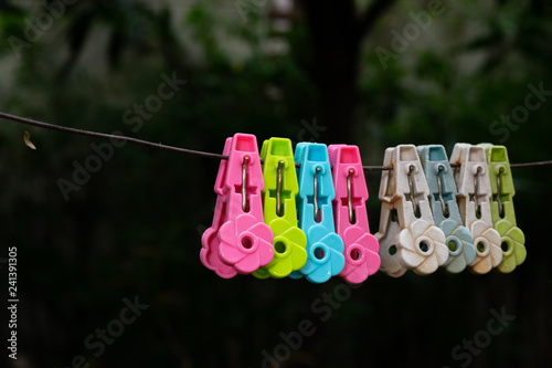 The clothespins clip on the wire