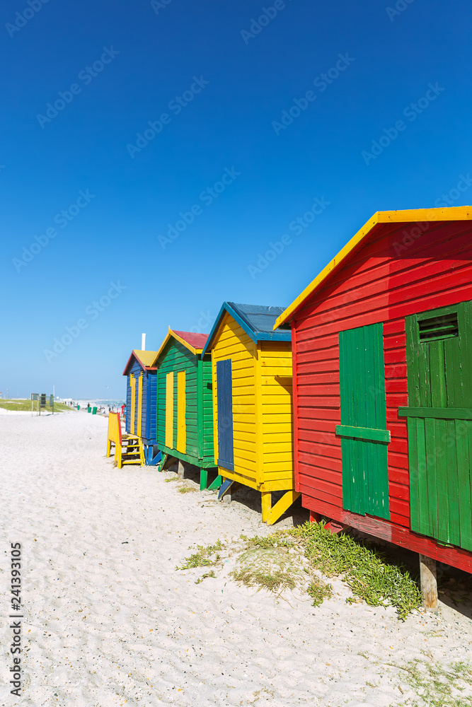 Naklejka premium Muizenberg beach with white sand and colorful wooden cabins in Cape Town, South Africa
